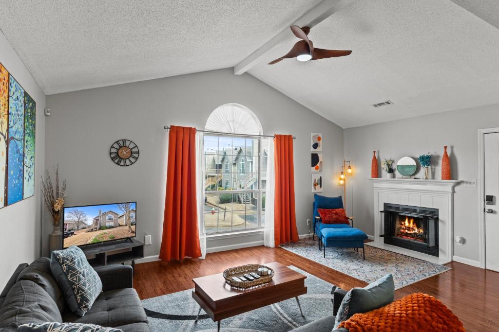 a living room with a couch and a fireplace at Spacious Corporate Condo - 2bd/2ba in Madison