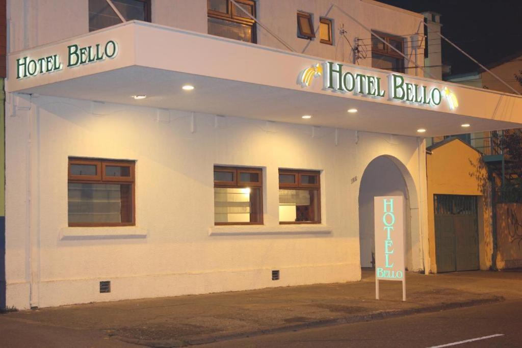 a hotel building with a sign in front of it at Hotel Bello, Andrés Bello 1166 in Temuco