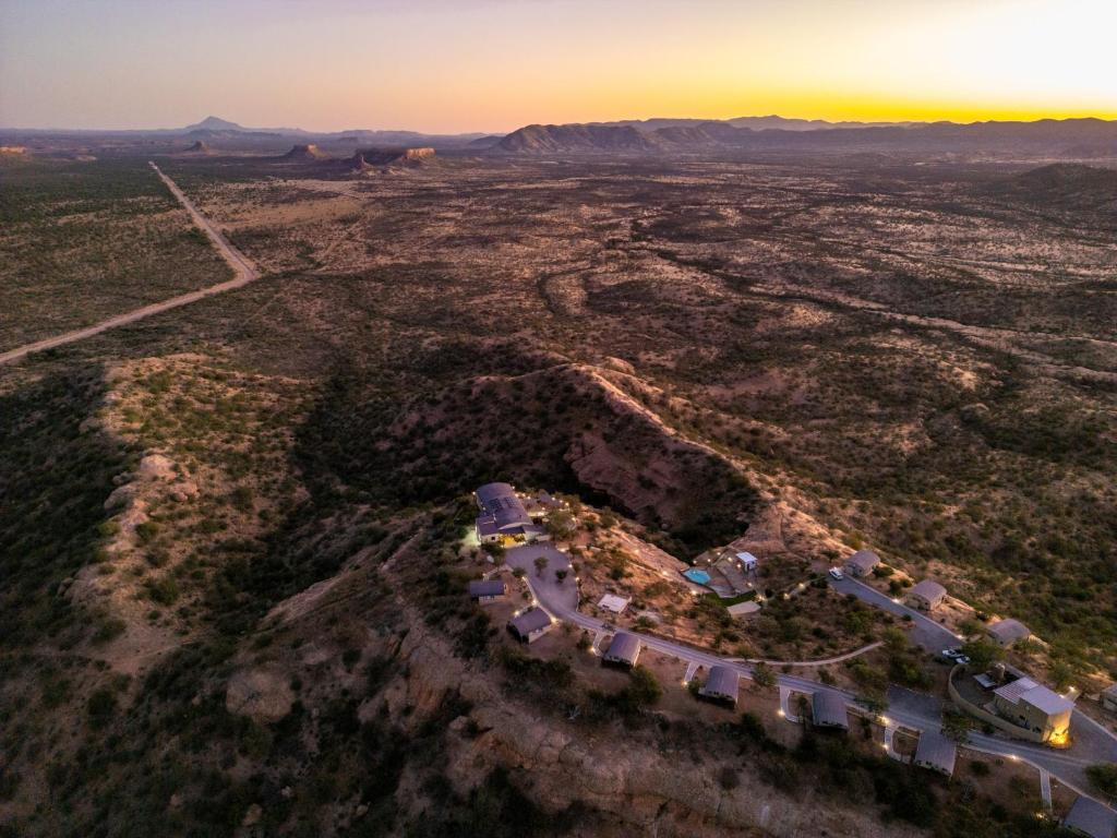 an aerial view of the desert at sunset at Ugab Terrace Lodge in Fingerklippe 