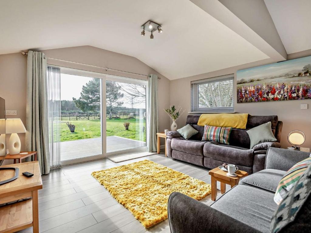 a living room with a couch and a table at 2 Bed in Ringwood oc-94272 in Saint Leonards