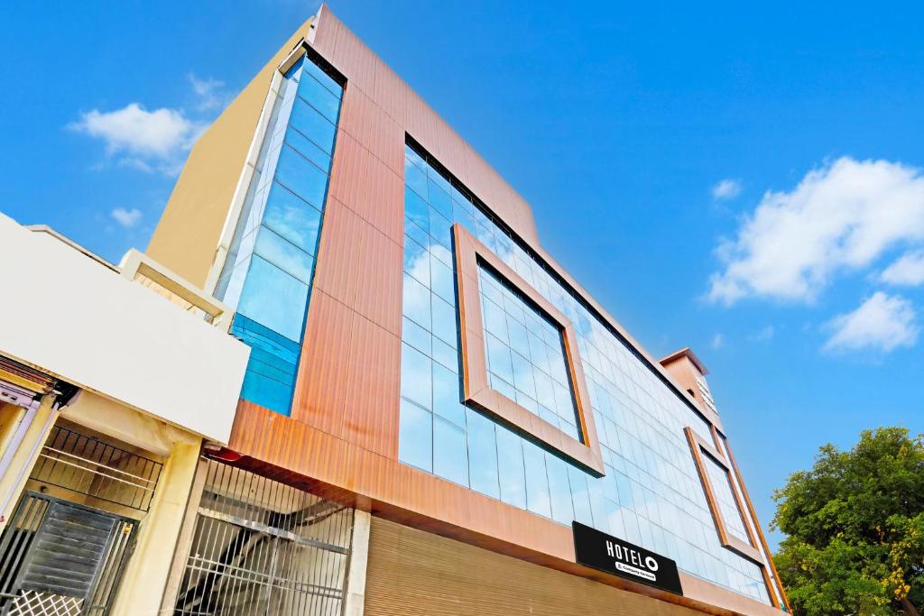 a building with glass windows on the side of it at Super Hotel O Raipur in Raipur
