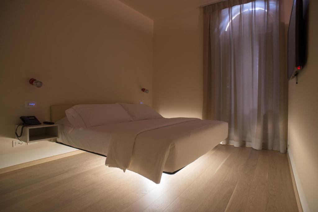 Postel nebo postele na pokoji v ubytování Verona Design