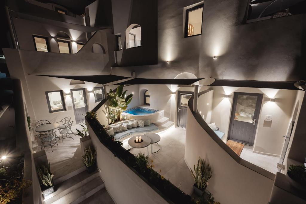 an overhead view of a house with a living room at Hotiday Santorini Mesaria in Fira