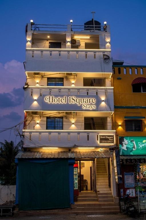 a building with a sign that reads clinical insurance signs at Starlight Hotel1Square in Pondicherry