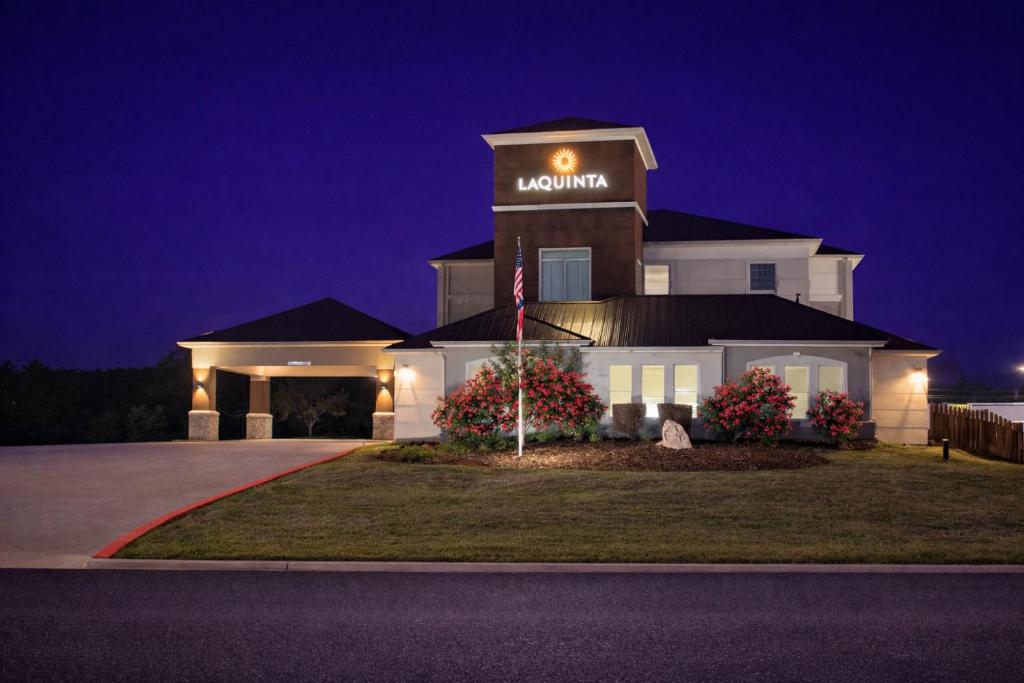 a house with a moon sign on top of it at La Quinta by Wyndham Kerrville in Kerrville