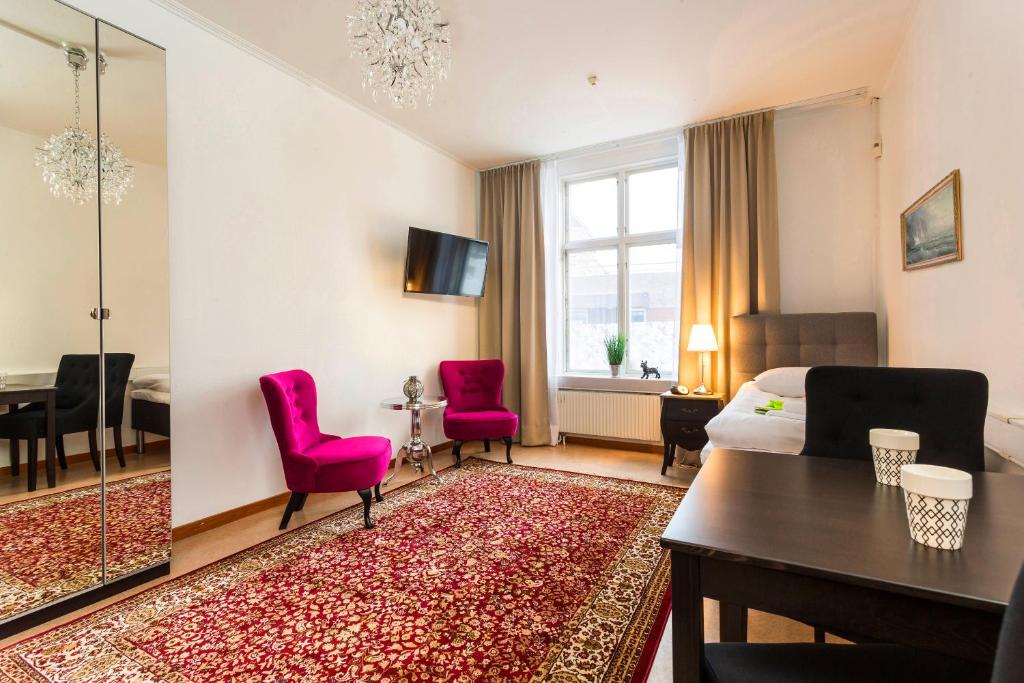 TV a/nebo společenská místnost v ubytování Hotell Drottninggatan 11
