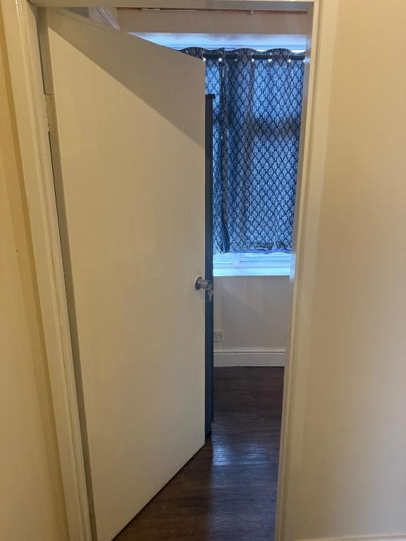 an open door with a window in a room at Apartment Sleeps 2 in Leigh