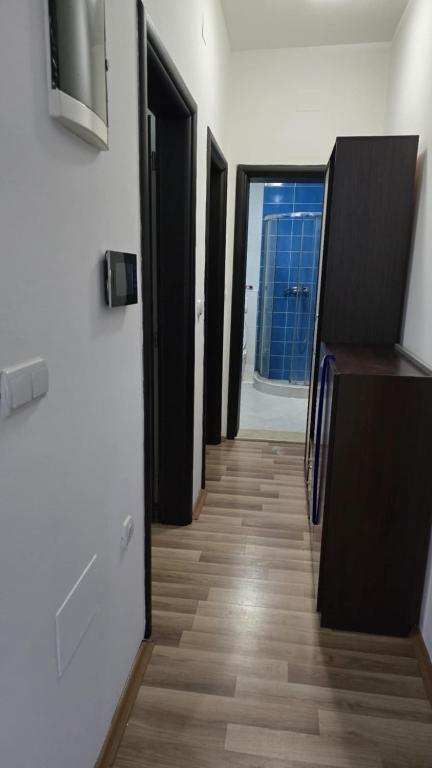 a hallway with several doors and a hallway with a hallwayngthngthngthngthngth at Ceca & Dimi 2 in Gevgelija