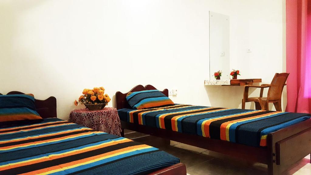 Postel nebo postele na pokoji v ubytování Kassapa Home Stay