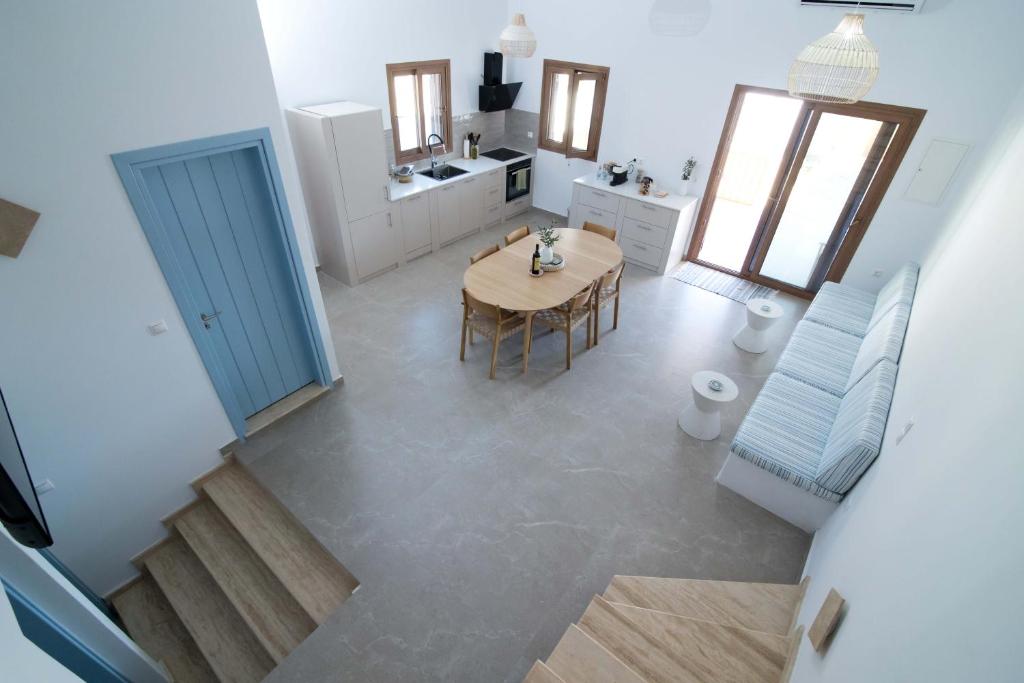 an overhead view of a kitchen and dining room with a table at Villa Yvon Telendos - Villa # 1 in Telendos