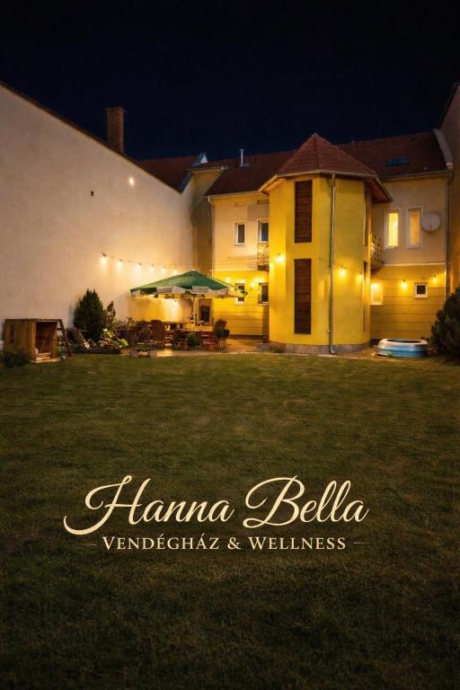a house with a lawn in front of it at HannaBella Vendégház & Wellness in Miskolc