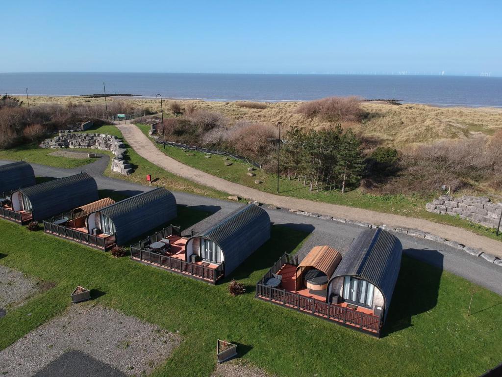 an overhead view of a farm with domes on the grass at Ffrith Park hotel pods in Prestatyn
