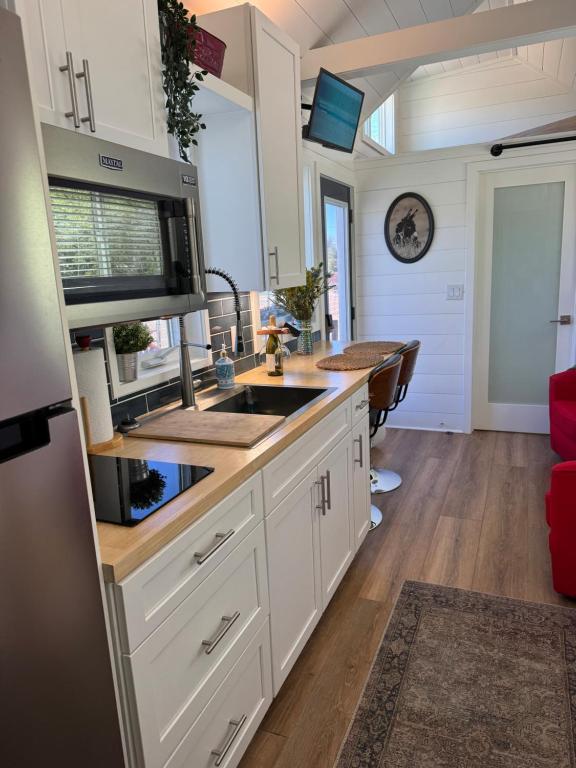 a kitchen with a sink and a counter top at Horseshoe Tiny home in Scottsdale