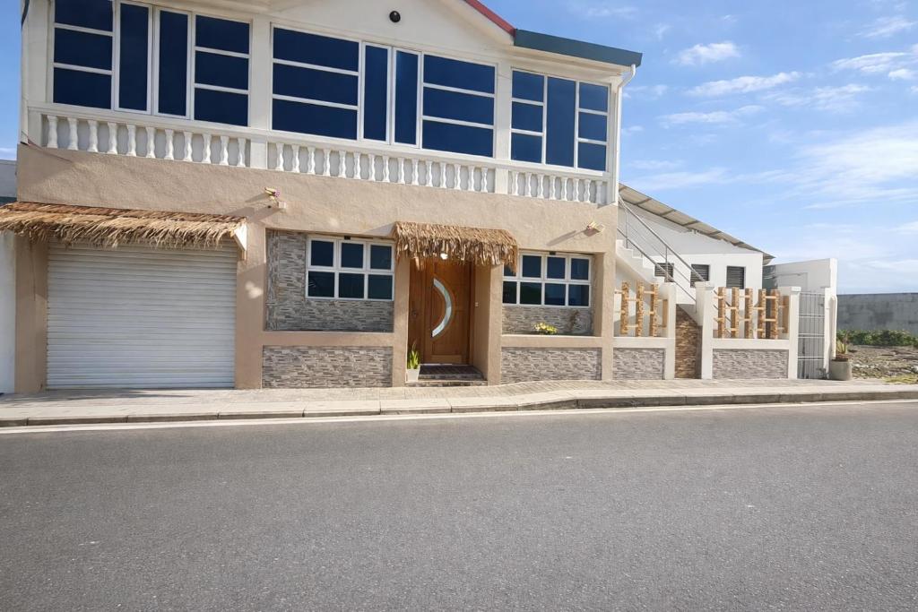 a house on the side of a street at Newsy Inn in Hithadhoo