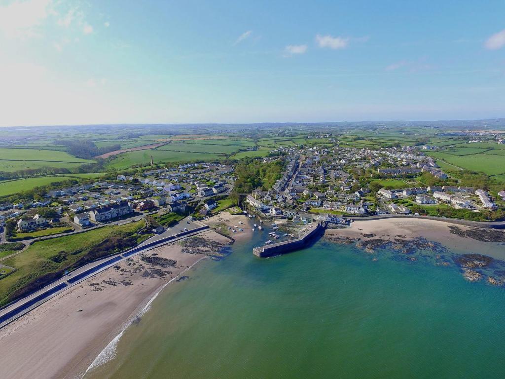 an aerial view of a beach and a city at Quayside in Cemaes Bay
