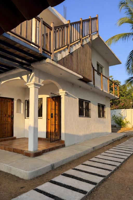 a house with a staircase on top of it at Casa Alma in Brisas de Zicatela