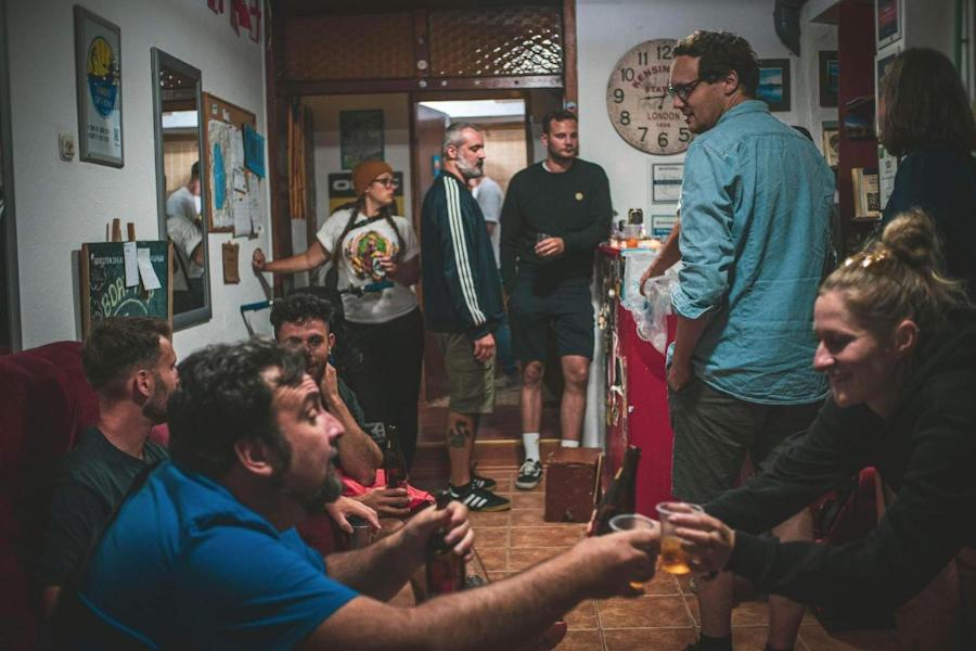 a group of people standing in a room at Sunset Lake hostel in Ohrid