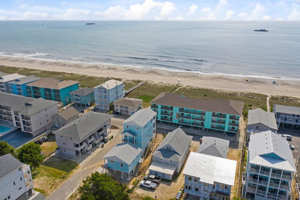 an aerial view of the beach and buildings at Sand Dollar Suites 2 in Carolina Beach