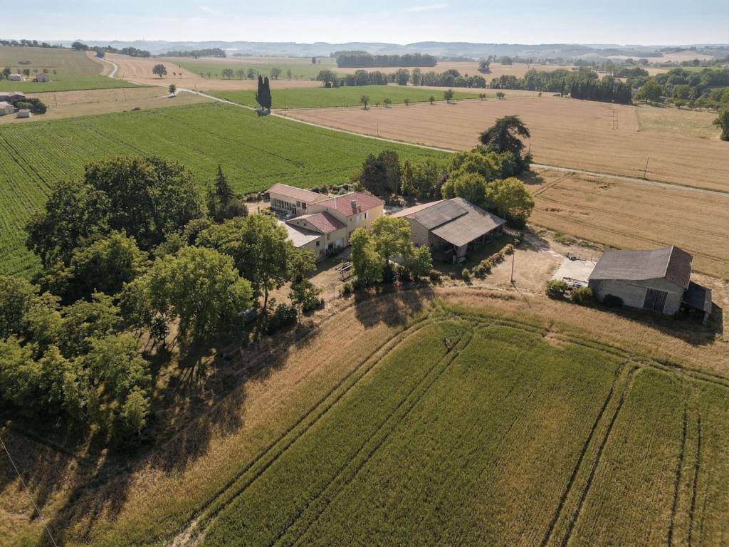 an aerial view of a house in a field at Gîte Chez Claudia in Marsolan