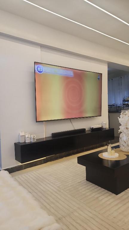 a large projection screen on a wall in a room at Cozzy homes in Ngong