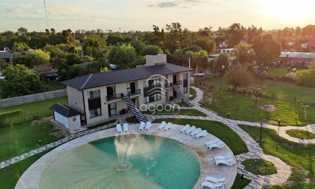 an aerial view of a house with a swimming pool at Lagoon Miramar in Miramar