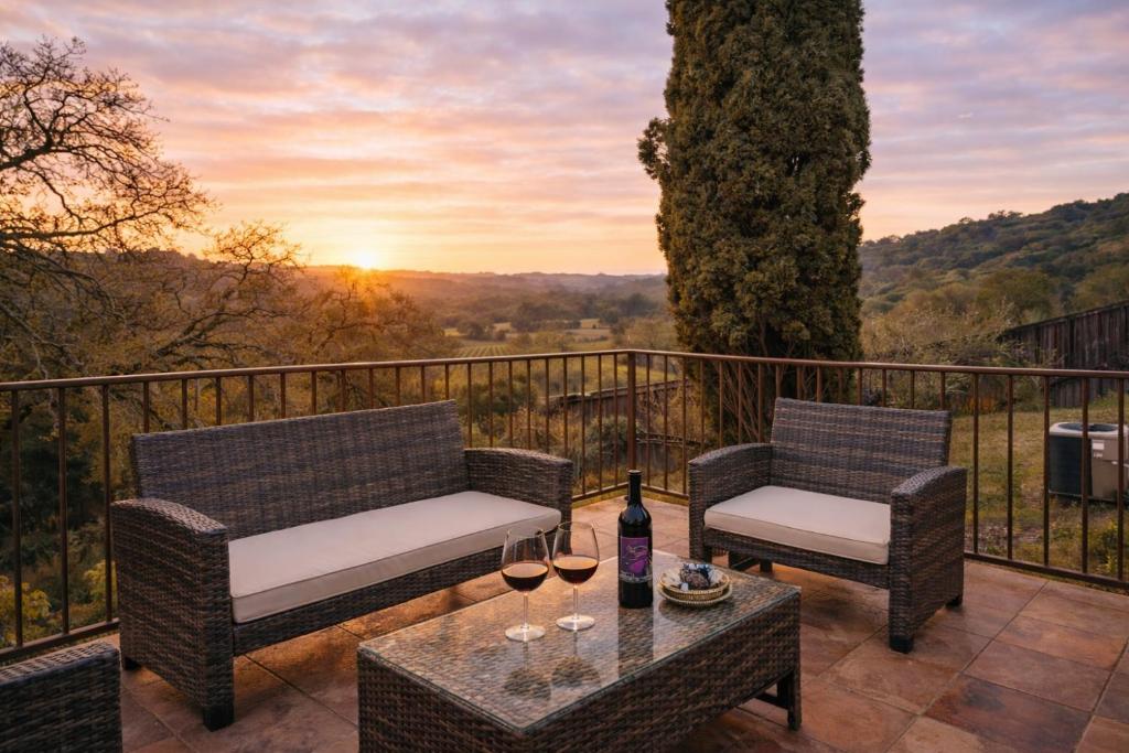 a patio with two chairs and a table with wine glasses at Healdsburg Wine Country Escape with Tasting Perks & Vineyard Views in Healdsburg