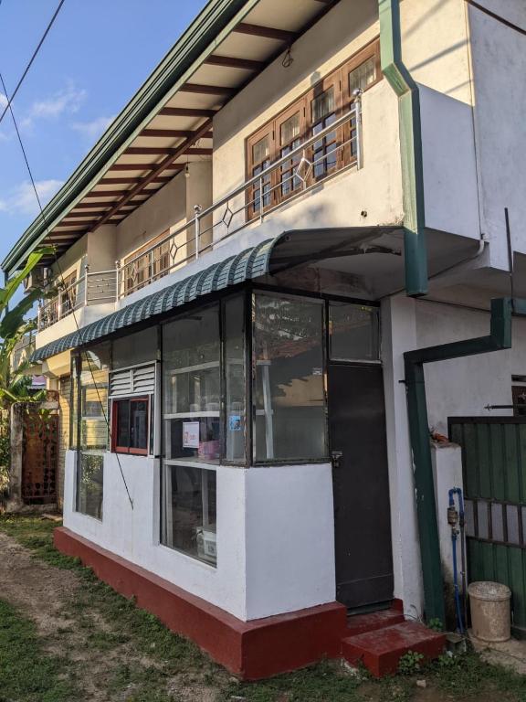 a building with a balcony on top of it at Stay in flying in Katunayaka