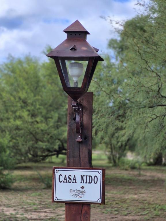 a light on a pole with a sign on it at Casa Nido San Javier in San Javier