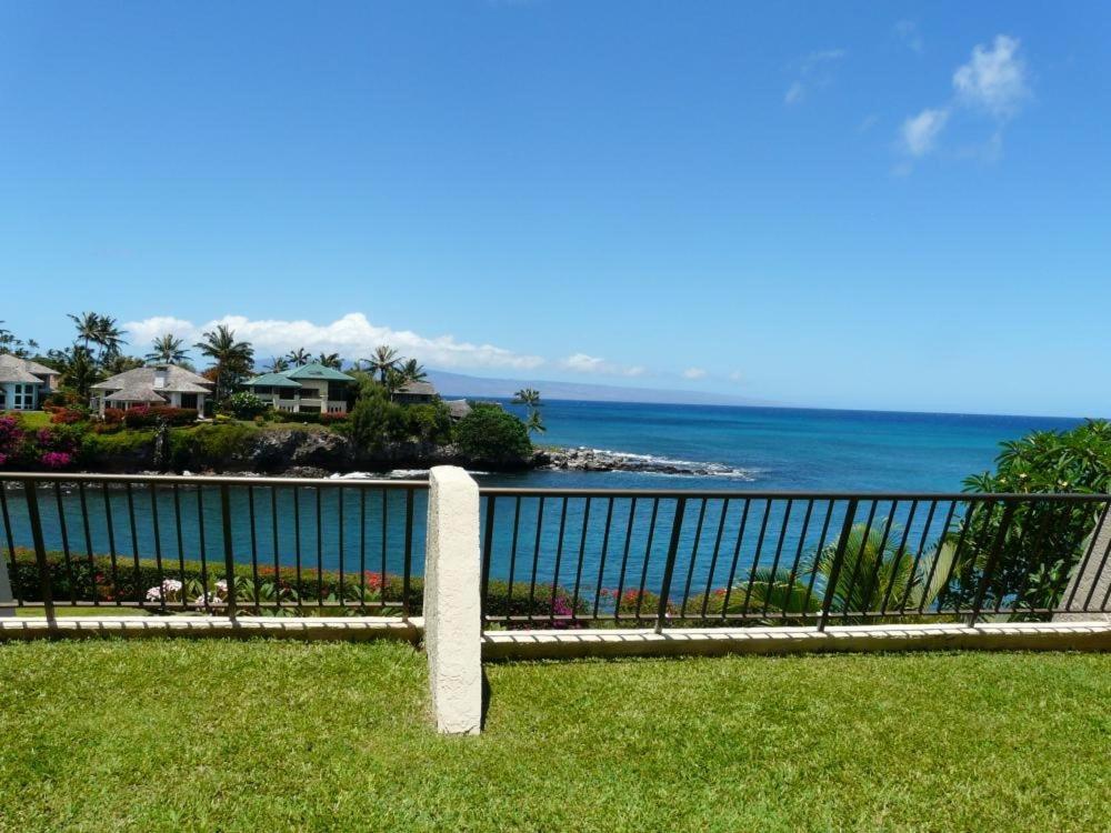 a fence with a view of the ocean at Napili Point Oceanfront Turtle View 1BR - Unit B30 condo in Lahaina