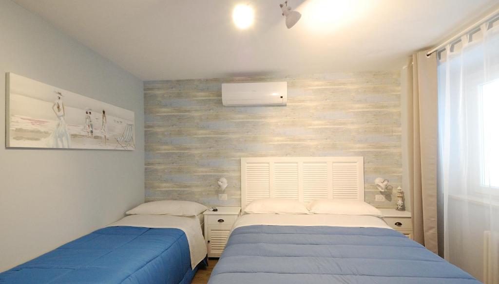 Postel nebo postele na pokoji v ubytování B&B Incanto sotto il mare