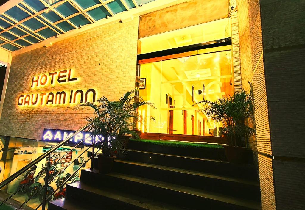 a building with stairs in front of a store at hotel Gautam Inn in Gorakhpur