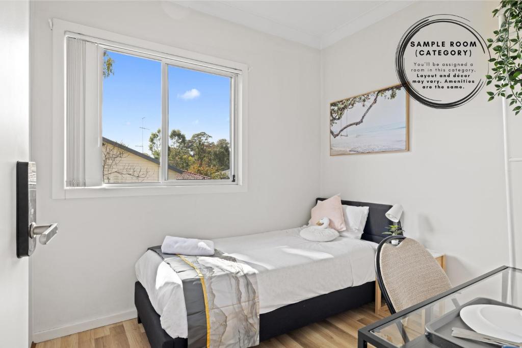a bedroom with a bed and a window at Single Room - Quaint Spot in Marayong - Centrally Located - Shared Bathroom in Blacktown