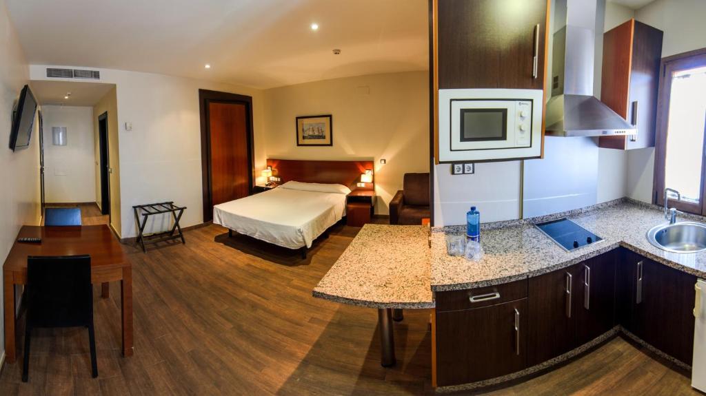 Posteľ alebo postele v izbe v ubytovaní Hotel Apartamento Martín Alonso Pinzón