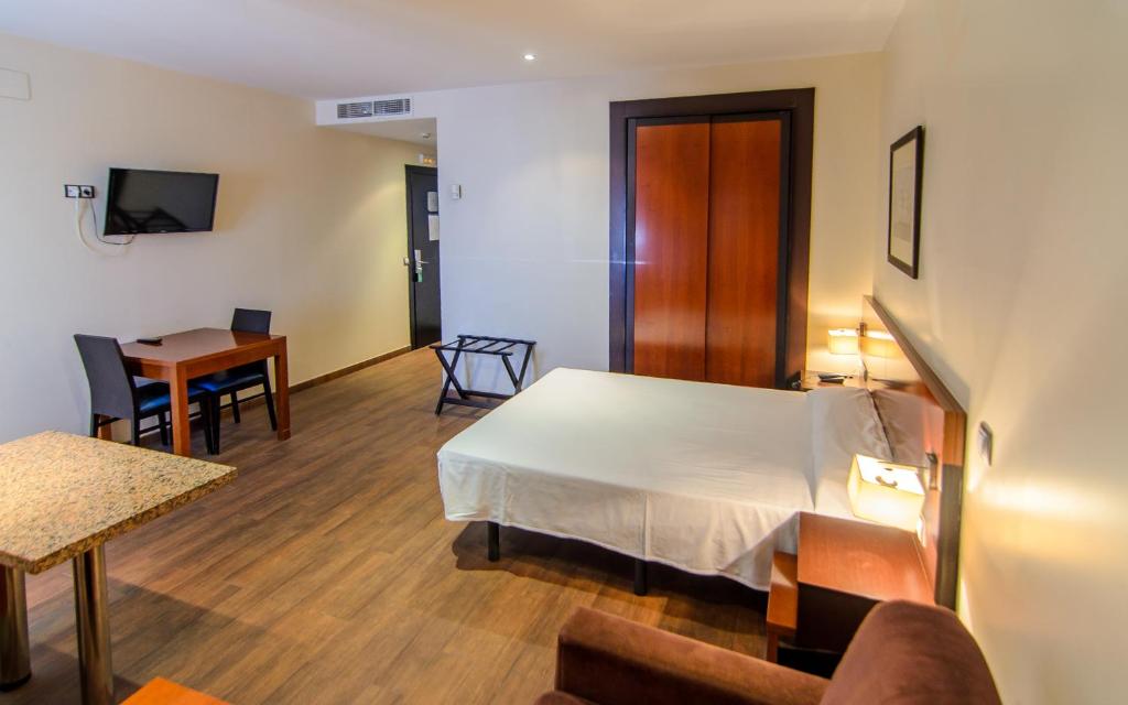 Posteľ alebo postele v izbe v ubytovaní Hotel Apartamento Martín Alonso Pinzón