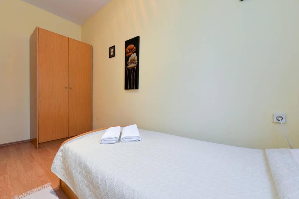 Łóżko lub łóżka w pokoju w obiekcie Apartments Doda
