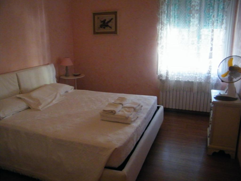Łóżko lub łóżka w pokoju w obiekcie Appartamento Vacanze I Provenzali