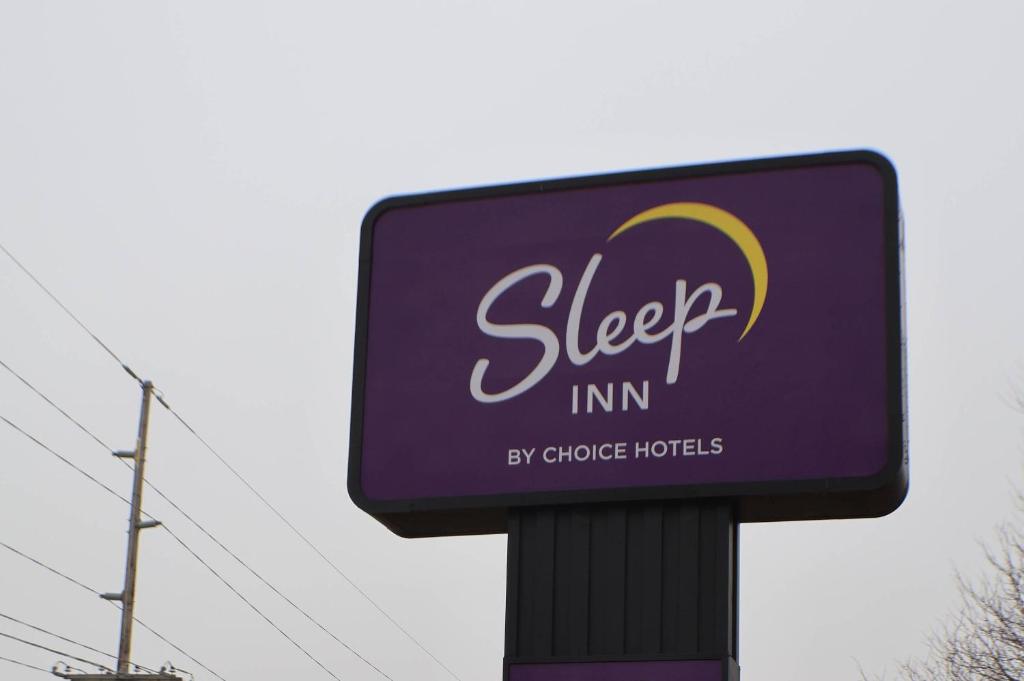 a purple sign for a sleep inn in a store at Sleep Inn Marion - Cedar Rapids in Cedar Rapids