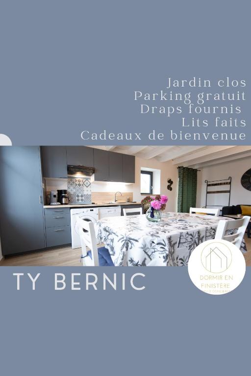 a dining room with a table and a kitchen at TY BERNIC maison en Pierre, lumineuse, 2 à 4 pers à Riec Sur Belon in Riec-sur-Bélon