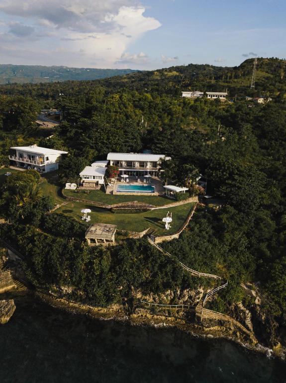 an aerial view of a house on a island in the water at Palalong Views in Dumanjug