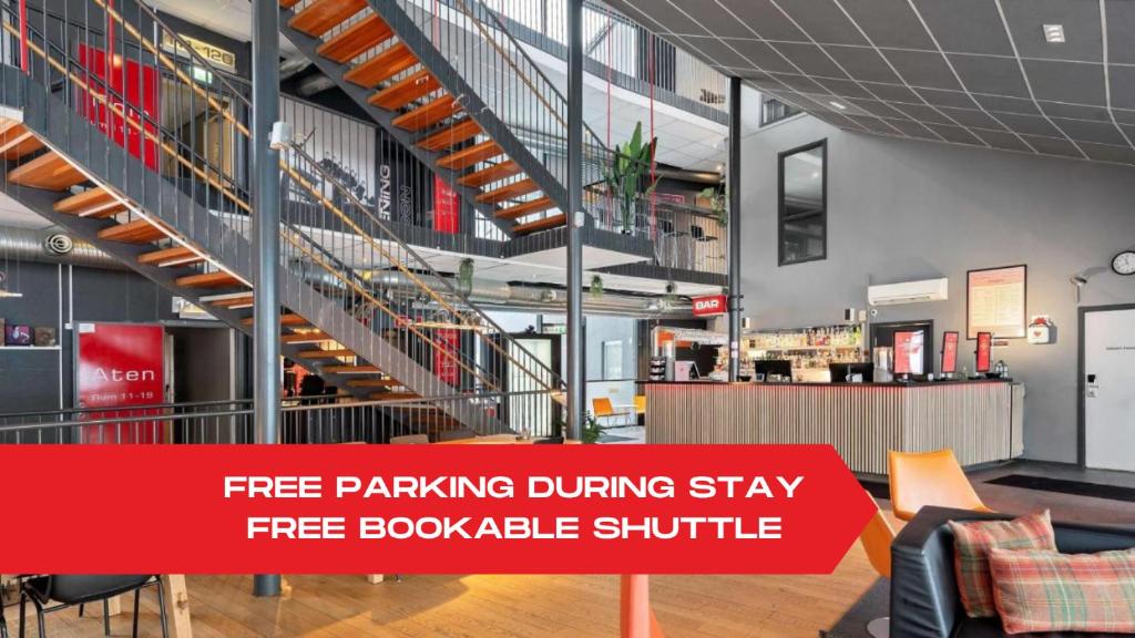 a large building with a free parking during stay in a bookable shuttle at Aiden by Best Western Stockholm Arlanda Airport in Arlanda