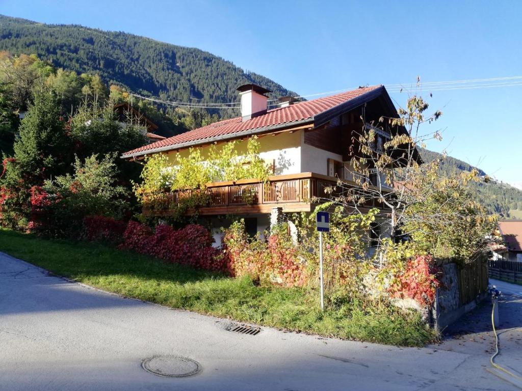 a house with ivy growing on the side of it at Ferienwohnung Naturglück in Sellrain