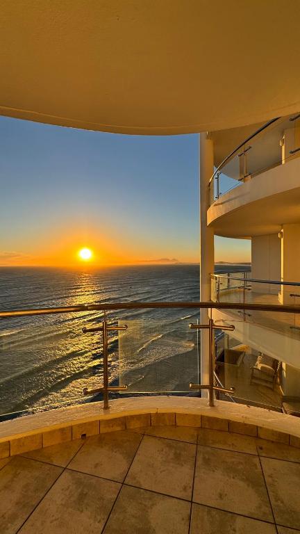 a view of the ocean from the balcony of a house at Hibernian Towers 1503 in Strand