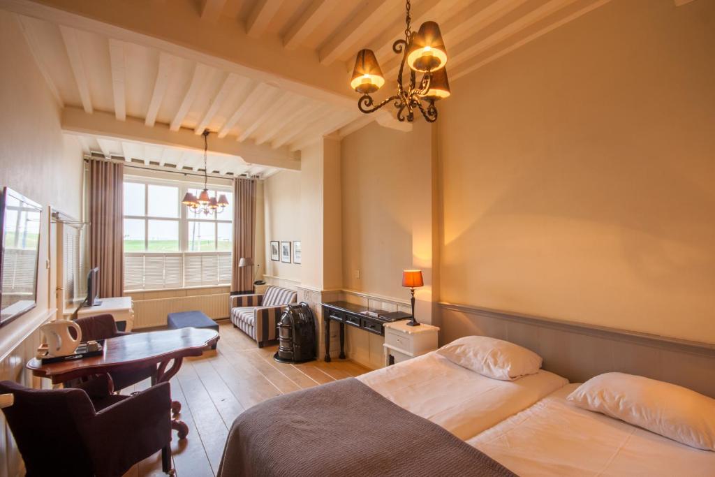 Postel nebo postele na pokoji v ubytování Auberge de Campveerse Toren