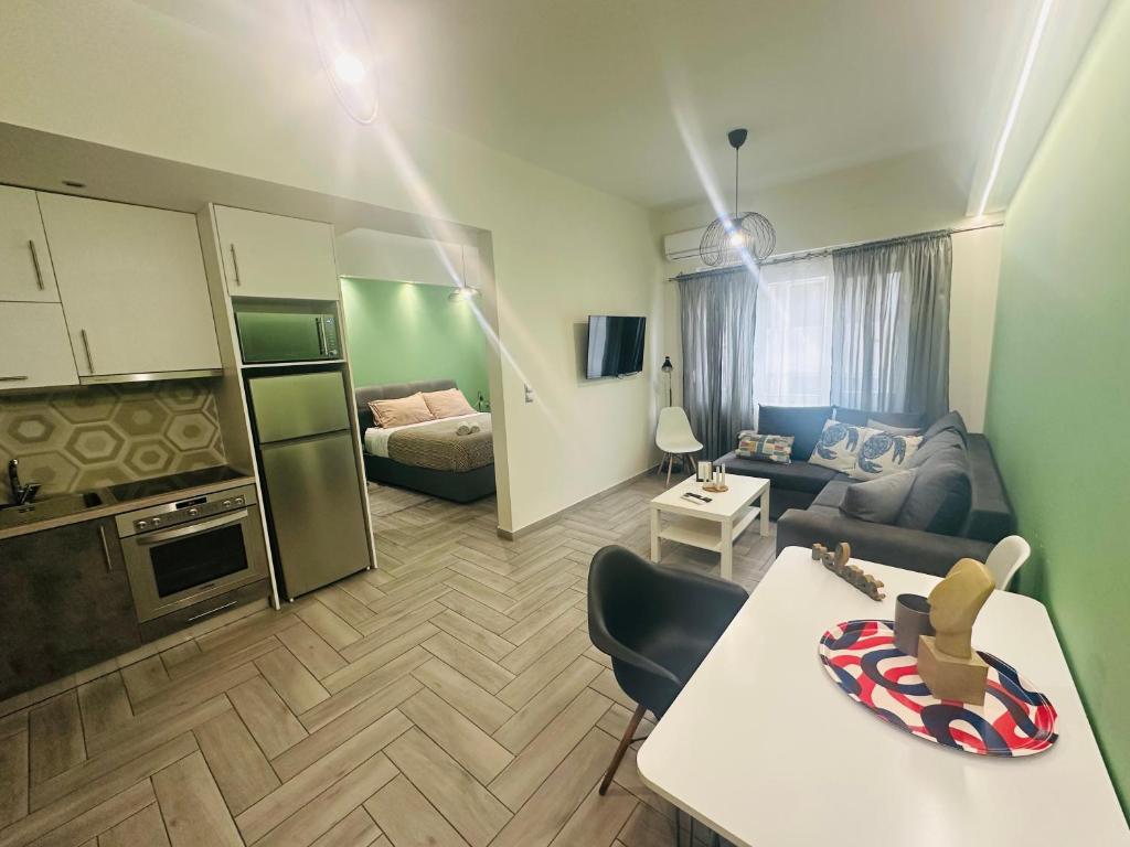 a living room with a couch and a table at Agatha-2 in Piraeus