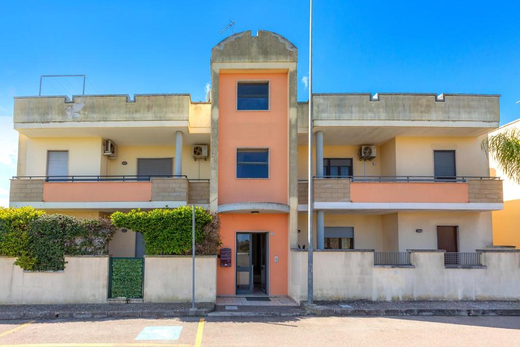 an apartment building with an orange at Borgagne Apartment by BarbarHouse in Borgagne