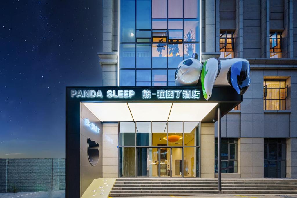 a building with a sign that reads panda sleep at Panda Sleepy Hotel（Chengdu Panda Base) in Chengdu