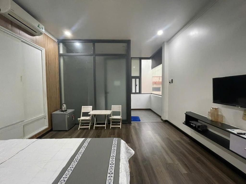 CENTRAL HOME - Habitación Deluxe (2 Adultos + 1 Niño)