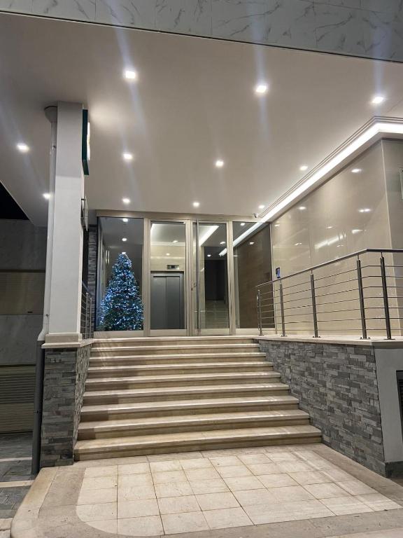 a christmas tree on the stairs of a building at Xenia in Crotone