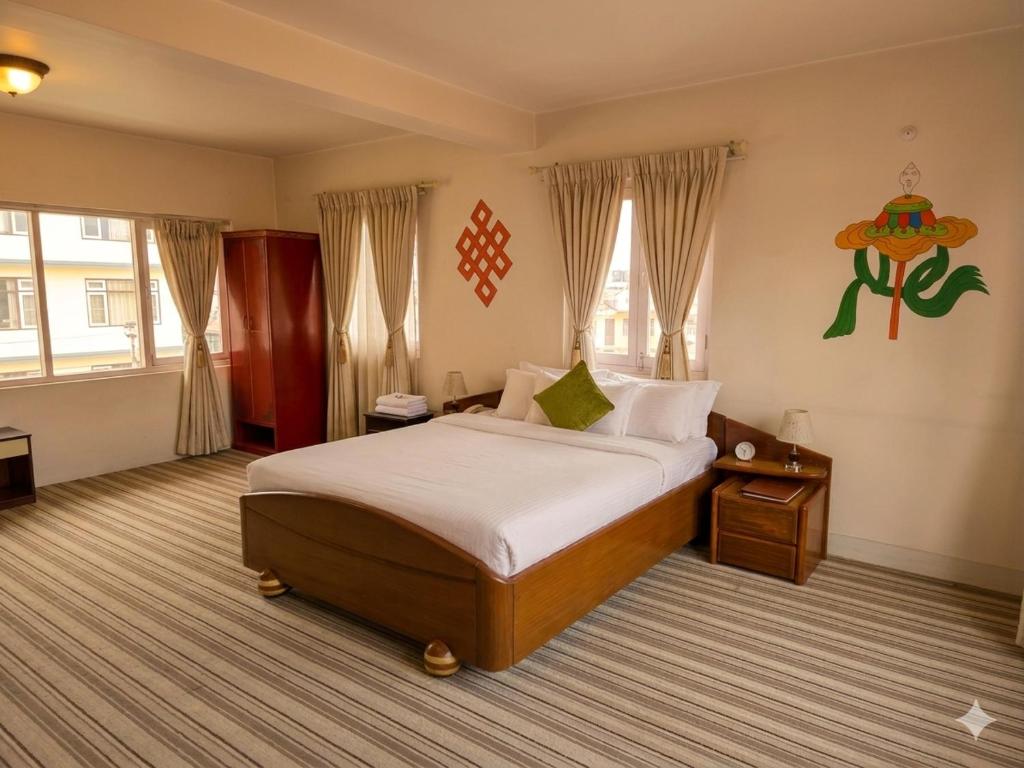 a bedroom with a large bed in a room at Boudha Orange Hotel in Kathmandu