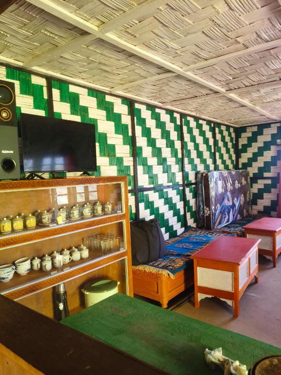 a living room with a couch and a table at Barsey Hillqueen Homestay in Sombāri